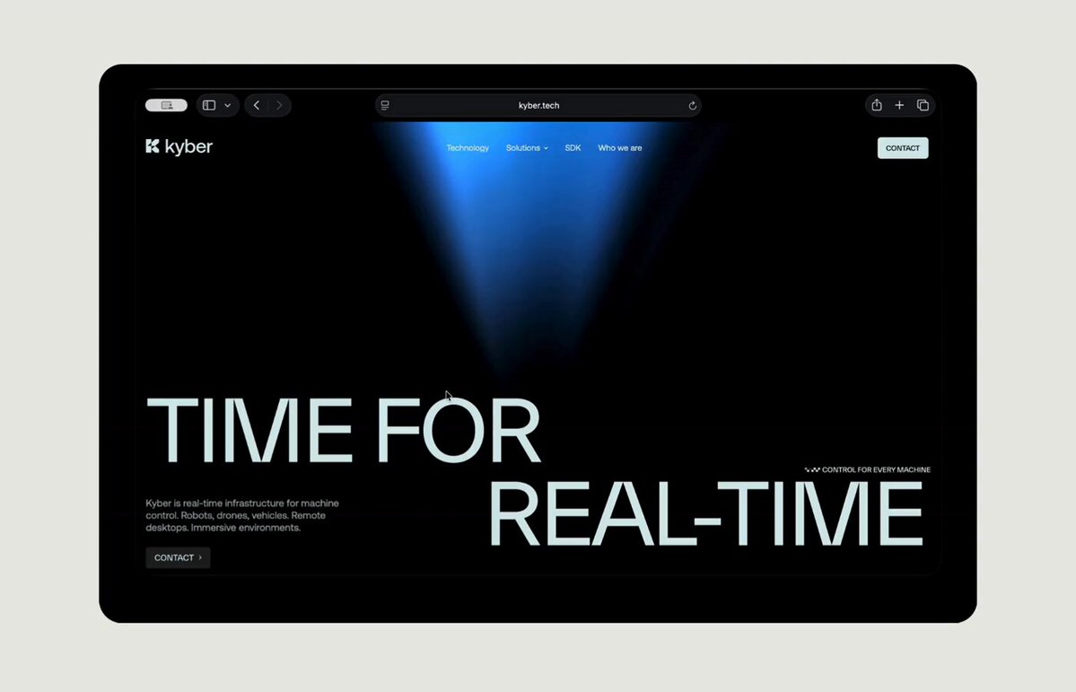 The image shows a computer screen displaying a website called "time for real-time" with a blue background, white text, and a light source coming from the top left corner. The website appears to be related to real-time control or monitoring of machines, as indicated by the phrase "Wordsss for Kyber: real-time control for every machine. Latency is dangerous. At 200ms of delay, a remote-controlled vehicle has traveled beyond where you intended to stop it. A surgical instrument is no longer where an incision was supposed to be made". The website seems to provide information or instructions on how to manage delays and ensure real-time performance in various applications.