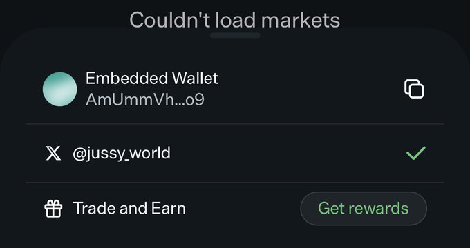 The image shows a mobile app screen displaying an "Embedded Wallet" with address "AmUmmVh...09", a connected X account "@jussy_world" (verified), and a "Trade and Earn" section with a "Get rewards" button. The header reads "Couldn't load markets," illustrating the post's note that markets are currently not loading.