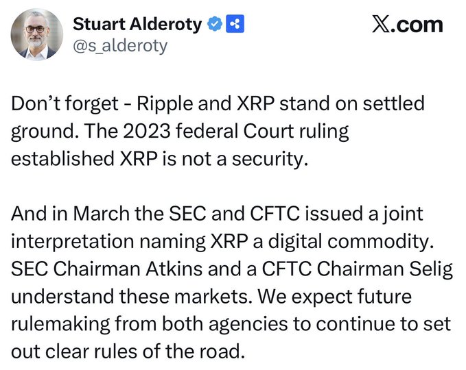 The image is an X (formerly Twitter) post from verified user Stuart Alderoty (@s_lderoty) where he argues that Ripple and XRP have legal clarity, citing the 2023 federal Court ruling that established XRP is not a security and a March joint SEC and CFTC interpretation naming XRP a digital commodity. The post aligns with the accompanying caption, with Alderoty emphasizing that future rulemaking from SEC Chairman Atkins and CFTC Chairman Selig will provide clear regulatory guidance for XRP.