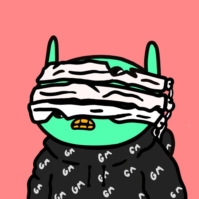 A green cartoon character with pointed ears wears a black hoodie patterned with "GA" lettering and has bandages wrapped around its eyes, matching the post's revival of NFTs. The "GA" markings throughout the hoodie likely represent the creator's NFT collection or brand signature.