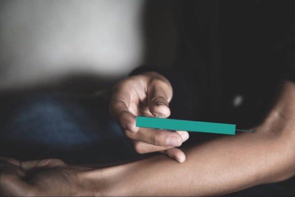 A trader's hand holds a teal-colored rectangle resembling a stock chart marker, symbolizing anticipation of a price movement. The caption "its coming i can feel it lets fill that juicy gap baby" pairs with the image to convey the trader's eagerness and confidence in an imminent market move.