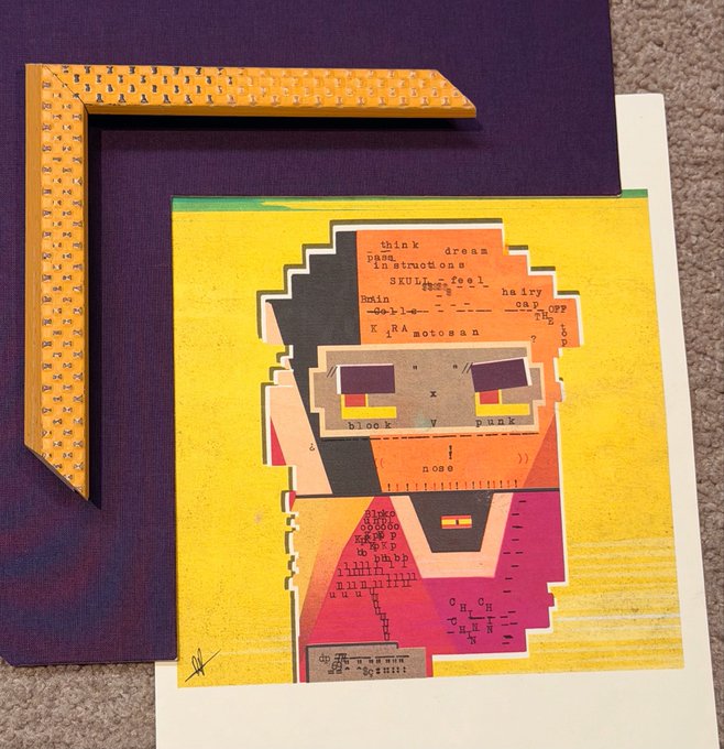 A colorful mixed-media collage artwork featuring a pixelated, text-filled face composed of orange, yellow, and red fragments, displayed alongside a yellow patterned L-shaped frame piece.