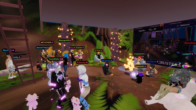 A screenshot from a Roblox virtual world/horror experience with multiple player avatars gathered in a forest area with string lights and a screen showing the game event.