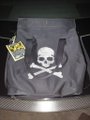A gray pirate flag with skull and crossbones design rests on a dark tiled floor, paired with a post mocking Justin Sun for allegedly wearing a spacesuit helmet over a baseball cap, suggesting he isn't actually a pirate—just a wannabe.

Key visual text/details: "PIRATE FLAG" tag/sticker on flag