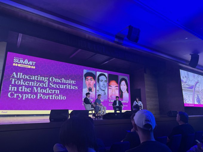 A panel at Solana Summit Singapore titled "Allocating Onchain: Tokenized Securities in the Modern Crypto Portfolio" with four speakers seated on stage in front of a large screen.