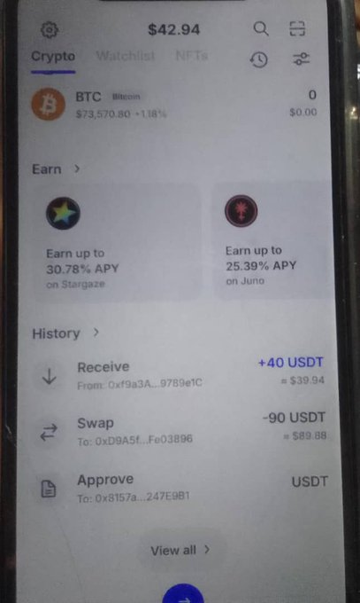 The image shows a cellphone screen displaying several cryptocurrency-related transactions such as earning Bitcoin or receiving Bitcoins from an Airdrop. There are multiple lines of text, including one about a "receive" command for Bitcoins with a total amount received of $40. Furthermore, there is a suspicious-looking advertisement in the form of a popup that reads "Referral airdrops scam". The post seems to be related to an email warning people not to fall for such schemes or invest their money without doing proper research into the cryptocurrency market or its associated risks and potential scams.