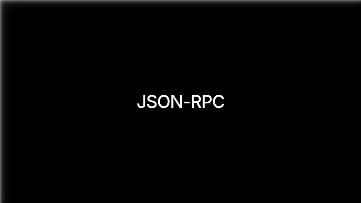 The image shows a black square with white text that reads "json-rpc", which appears to be an advertisement for a service or product related to JavaScript. The background of the image is gray, providing a neutral backdrop that allows the white text on the black square to stand out prominently.