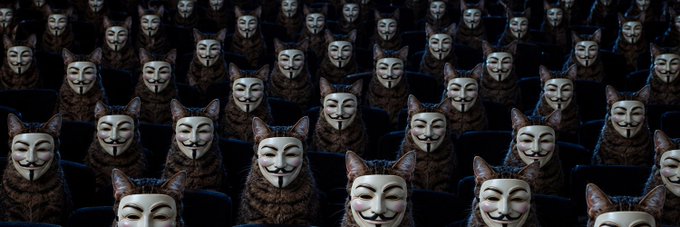 An image showing numerous identical Guy Fawkes masks and cat-eared figures arranged in rows in a dark setting, evoking themes from the movie 'V for Vendetta'.