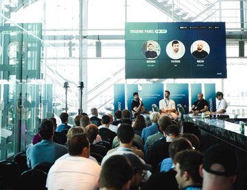 A packed conference room attends a panel discussion at DutchBlockWeek, with a large screen displaying "HYPERLIQUID" branding and headshots of speakers, as the European growth story of the Hyperliquid ecosystem takes center stage.