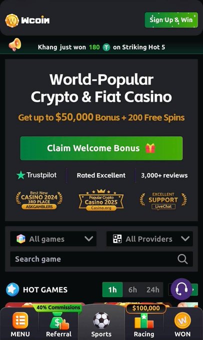 A screenshot of the Wcoin website advertising itself as a 'World-Popular Crypto & Fiat Casino' with a '$50,000 Bonus + 200 Free Spins' welcome offer and a banner noting 'Khang just won 180' on Striking Hot 5.