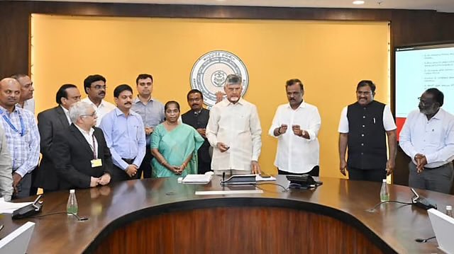 In this photo we see an Indian man the has been added prime minister of Andhra Pradesh, Y.S. Jagan Mohan Reddy who is speaking at a public conference. There is break unwanted corruption in land records and with the logistics of public funds.