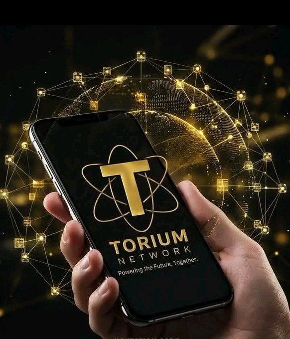 A hand holds a smartphone displaying the Torium Network logo and the tagline "Powering the Future, Together," set against a glowing digital globe and network of connected nodes—reinforcing the post's description of an upcoming EVM-compatible Layer 1 blockchain launching in 2027.