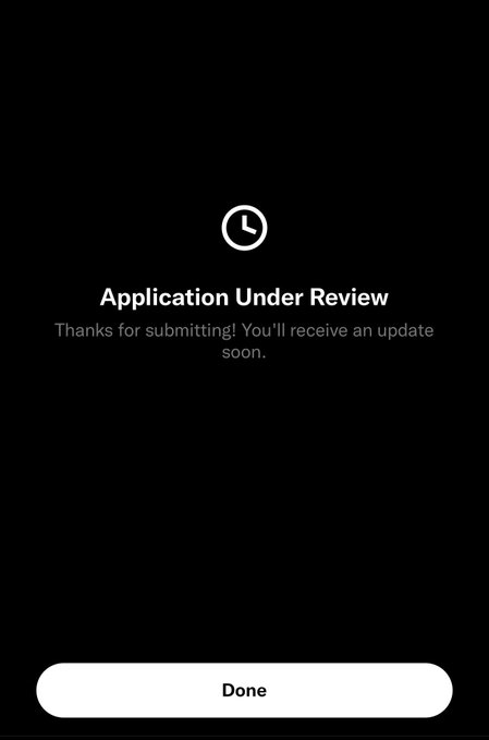 The image shows a mobile confirmation screen with a clock icon stating "Application Under Review" and a note "Thanks for submitting! You'll receive an update soon," along with a "Done" button. It appears to mock a platform's rejection or indefinite review status, symbolizing the user's frustration in the post about supposedly being denied access and their "daddy" selling out instead.
