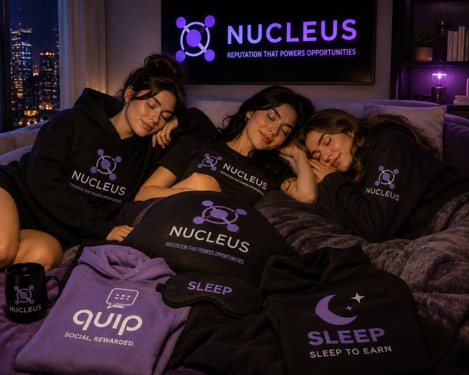 Three women lounge together on a bed, eyes closed in peaceful slumber, surrounded by branded merchandise featuring "NUCLEUS - Reputation That Powers Opportunities," along with a black "quip" mug reading "SOCIAL, REWARDED." and dark sleep masks/pillows displaying "SLEEP" and "SLEEP TO EARN," while a glowing purple Nucleus logo with its tagline illuminates the city skyline behind them.

The image visually reinforces the post's message by contrasting the chaos of "loud wallets" and "active farmers" with the calm of genuine contributors—portraying the Nucleus community as real people resting peacefully while their reputation-based system works for them, turning sleep into value rather than rewarding mere noise.