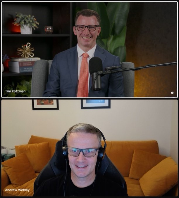 A split-screen video call between Tim Kotzman (top, in a suit with an orange tie) and Andrew Webley (bottom, wearing headphones).