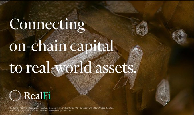 An advertisement for 'RealFi' with the tagline 'Connecting on-chain capital to real-world assets,' featuring a crystal resting on a golden block, with disclaimer text about US, EU, and UK restrictions.