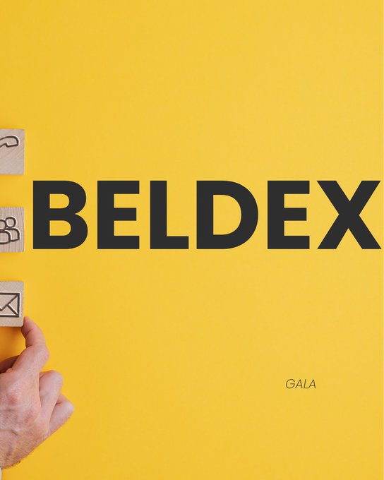 A yellow promotional graphic for 'BELDEX GALA' showing wooden tiles with symbols being arranged by a hand.