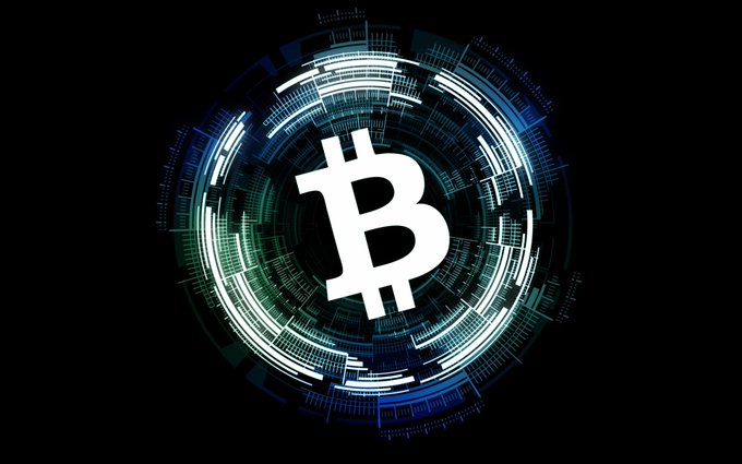 The image features a white Bitcoin symbol within a blue circle against a black background. The Bitcoin logo is surrounded by various lines, which are part of an abstract design that gives the impression of a complex network or system. The caption below the image reads "Focus on what is in the image and how it relates to the post".