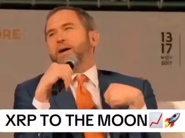 The image features a man wearing a suit and tie standing behind a microphone, speaking into it as if he were addressing an audience. The text "XRP" can be seen in the image, which suggests that the man might be discussing or promoting the use of Ripple cryptocurrency for global payments. The post also mentions that the Bitcoin experiment is reaching its limits, implying that there may be a limit to how much money can be sent using Bitcoin as a payment method.

The man's speech seems to be centered around the idea of XRP being the future of global finance and the potential benefits it could bring in terms of increased efficiency and lower transaction costs. The image captures this moment, with the man standing behind the microphone and delivering his message to an unseen audience.
