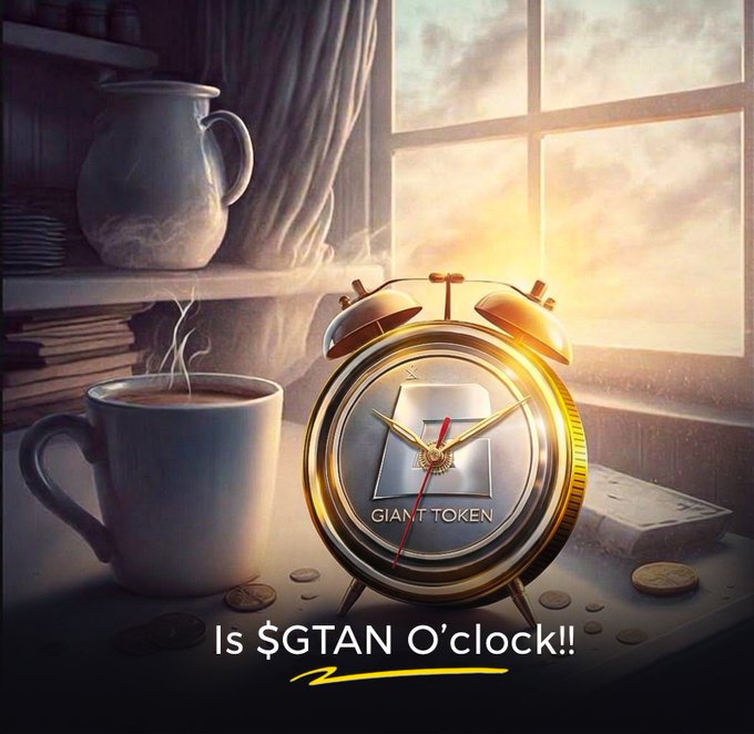 A promotional image featuring a golden alarm clock with 'GIANT TOKEN' on its face next to a steaming mug, with text 'Is $GTAN O'clock!!' below.