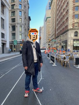 A man stands in a city street wearing red sneakers and a playful pixel-art “P” sign over his face, with outdoor café seating lining the road. The caption “Well, that’s sooooooo goood • ᴗ •” adds to the image’s cheerful, silly mood.