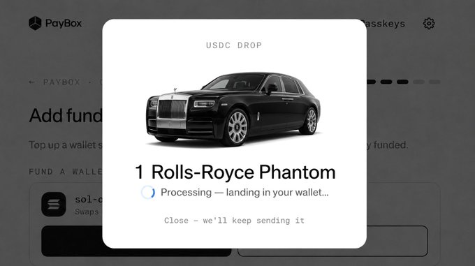 A PayBox app interface showing a USDC DROP notification for '1 Rolls-Royce Phantom' with the status 'Processing — landing in your wallet...' over a darkened background.