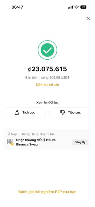 A mobile screenshot of a successful cryptocurrency transaction showing ₫23,075,615 received, with the Vietnamese text indicating 'Bán thành công 902,08 USDT' (Successfully sold 902.08 USDT) and a Binance promotion for receiving $150.