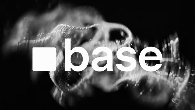 The image displays the white "base" logo (with its signature square icon) overlaid on a dark, abstract background featuring blurred glass-like or liquid textures. It relates to the post by serving as a visual identifier for the Base ecosystem, reinforcing the call to actively use Base-native platforms like Aerodrome for trading and governance participation.