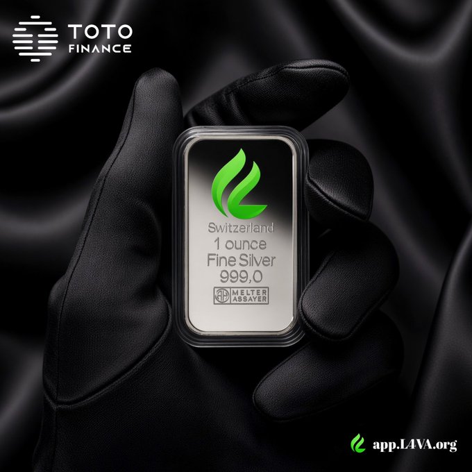 A promotional image for TOTO FINANCE showing a hand in a black glove holding a sealed 'Switzerland 1 ounce Fine Silver 999.0' bar, with the URL 'app.LAVA.org' in the corner.
