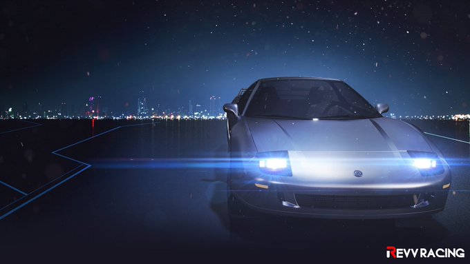 A cinematic image of a silver sports car with bright headlights on a dark tarmac at night, with city lights in the background and the 'TEVVRACING' logo in the bottom right corner.