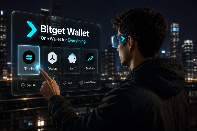 A person wearing smart glasses interacts with a futuristic holographic Bitget Wallet interface that displays "One Wallet for Everything" along with four main features: Trade, DApps, Earn, and Markets, set against a nighttime cityscape backdrop. The image visually reinforces the post's message by showcasing the wallet's all-in-one Web3 functionality in an advanced, tech-forward setting.