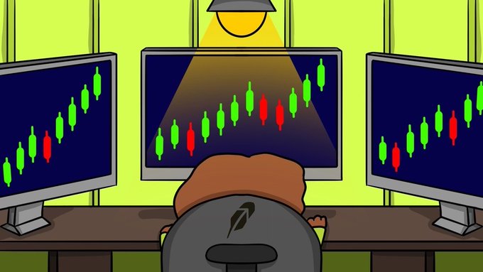 A cartoon trader sits at a desk illuminated by a spotlight, facing three monitors displaying green and red candlestick charts with no visible text or tickers. The image humorously captures the intense, all-eyes-on-the-markets focus of a "$SPURDO dev" anxiously watching price action just before a token launch.