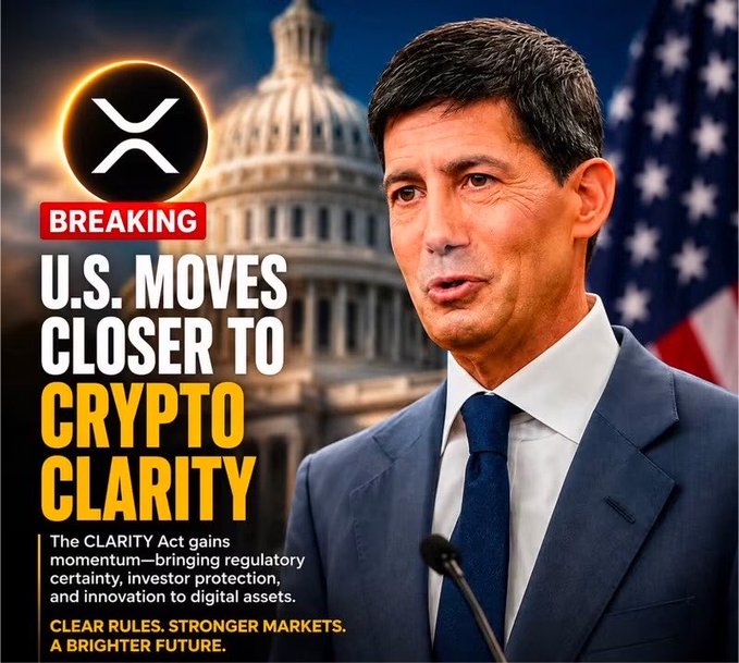 The image features a man in a dark suit and tie standing in front of the U.S. Capitol building and an American flag, with bold text reading "BREAKING: U.S. MOVES CLOSER TO CRYPTO CLARITY" and a subheading noting that "The CLARITY Act gains momentum—bringing regulatory certainty, investor protection, and innovation to digital assets." The XRP logo appears in the top left corner, tying the image to the post about the Federal Reserve Bank of Atlanta recognizing XRP as an "international payment medium or wholesale settlement coin," highlighting growing institutional and governmental acknowledgment of the cryptocurrency's legitimate role in finance.