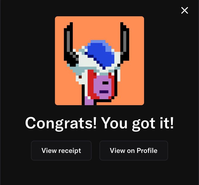 A dark user interface screen displays a pixel art icon featuring a purple face with horns and a blue shape above it. Below the icon, large text reads "Congrats! You got it!" above two buttons labeled "View receipt" and "View on Profile".