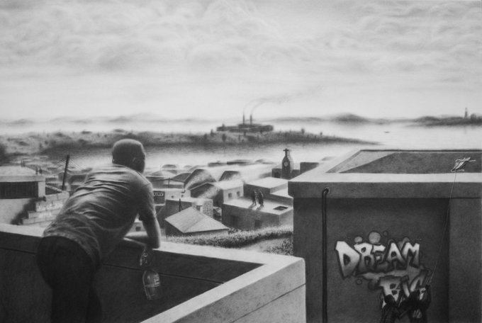 A black and white photograph showing a person leaning over a balcony wall holding a bottle, looking out over a town with industrial smokestacks in the distance, with 'DREAM' graffiti visible on a nearby wall.