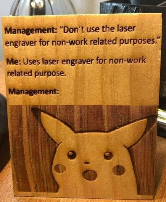 A wooden plaque features engraved text reading 'Management: "Don't use the laser engraver for non-work related purposes." Me: Uses laser engraver for non-work related purpose. Management:' above a carving of the Pokémon Pikachu's face.