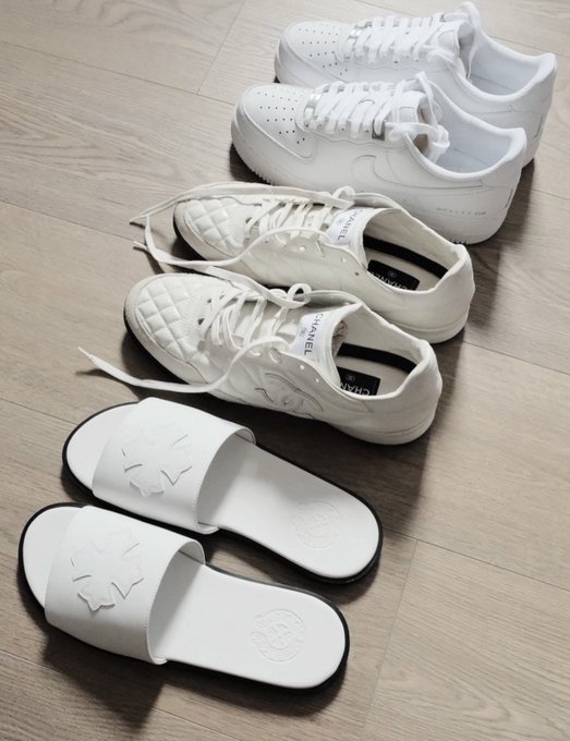 Three pairs of white shoes (Nike Air Force 1s, Chanel sneakers, and Tory Burch slides) rest on a wooden floor—ranging from budget to high-end luxury—suggesting that in crypto, as in fashion, only those who weather the volatility with both balance and composure endure.