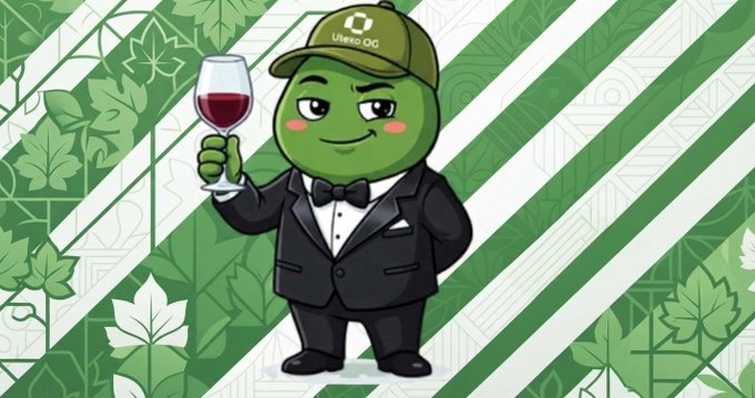 A green mascot wearing a black tuxedo and a cap labeled "Utexo OG" holds a glass of red wine, with the cape's text reinforcing the post's announcement that Utexo is simplifying Bitcoin development. The dapper character's confident toast visually symbolizes Utexo's elegant approach to making Bitcoin easier to build on.