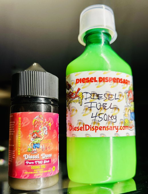 Two products from Diesel Dispensary: a small black bottle of 'Diesel Dawg Pure THC Shot 100MG THC' and a larger green bottle labeled 'Diesel Fuel 450mg'.