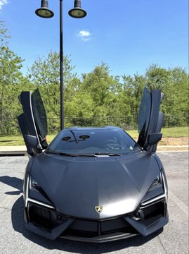 A new Lamborghini Revuelto with its scissor doors raised is showcased in the image, symbolizing the luxury lifestyle the post promotes—suggesting that investing with "Coach_Megan89" can help turn such dream purchases into reality.