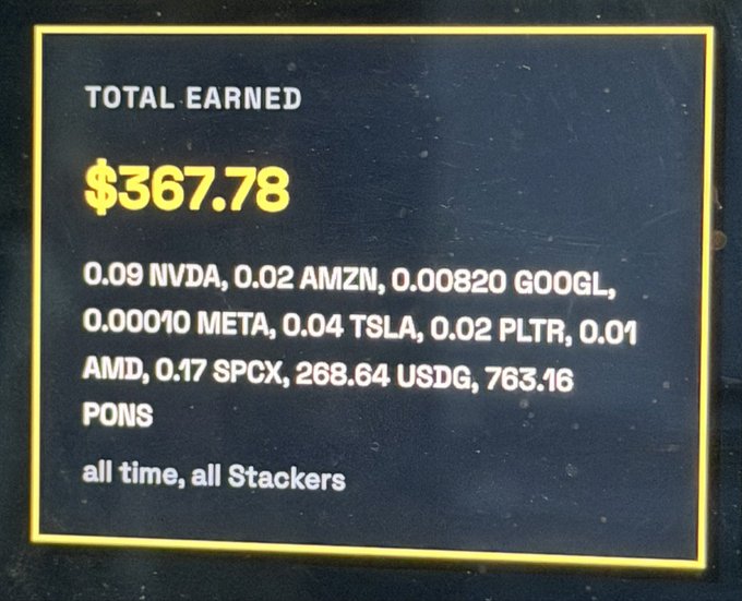 A digital display of 'TOTAL EARNED $367.78' listing assets including 0.09 NVDA, 0.02 AMZN, 0.00820 GOOGL, 0.00010 META, 0.04 TSLA, 0.02 PLTR, 0.01 AMD, 0.17 SPCX, 268.64 USDG, and 763.16 PONS, noted as 'all time, all Stackers'.