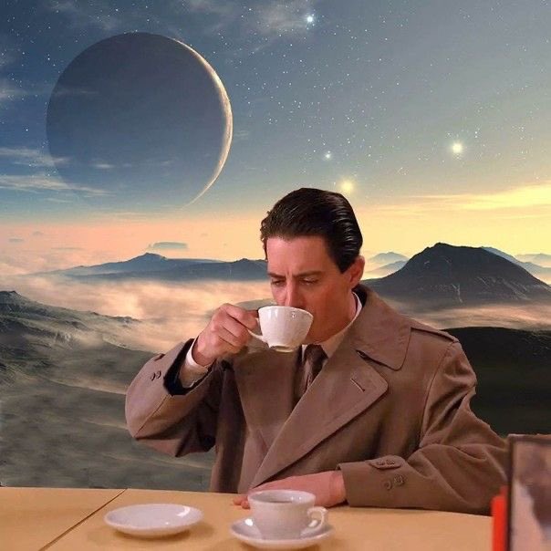 A surreal scene of a man in a beige trench coat sipping from a white teacup at a table, set against an alien landscape with mountains, clouds, stars, and a crescent moon.