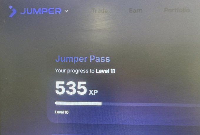 A Jumper exchange interface displaying 'Your progress to Level 11' with 535 XP earned, showing Level 10 at the bottom of the progress bar, with Trade, Earn, and Portfolio navigation options.