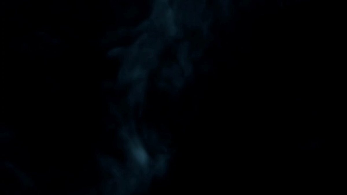 The image features a large, dark-colored smoke screen with a small amount of light coming from the top right corner. The smoke appears to be coming out of an oven or a similar appliance, creating a sense of warmth and coziness. The background is black, which contrasts with the white text that reads "We're live with another weekly dose of the WakeAndBakeVibez Join us on these platforms: Youtube: youtube.com/live/FMyvaCbN9 ... Instagram: instagr.am/kamikaze_monsu ... StreamYard: streamyard.com/nietersfre #XRPL #NFT #Music #Artists". The image is accompanied by a caption that provides additional information about the content and its source, likely a social media platform or website.