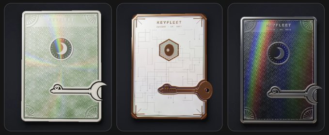 Three collectible key-themed cards from 'KEYFLEET' displayed side by side, each featuring a unique design—a moon symbol on iridescent green, a hexagon on white with circuit patterns, and a crescent moon on a holographic dark background.