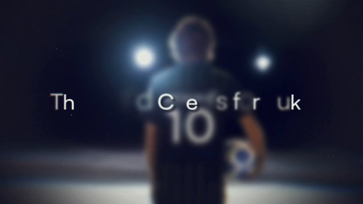 The image features a person holding a soccer ball with the number 10 written across their back. The background of the image is dark, which contrasts with the bright white text that reads "Th #WEAREINTHEGAME Global Support Campaign | Airdrop 100 USDT". This post appears to be promoting an international campaign or event related to soccer and raising funds for a cause.