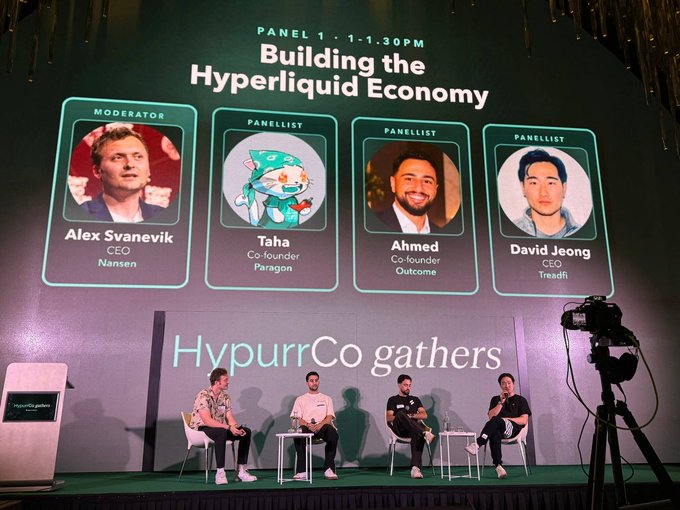 A panel discussion at 'HypurrCo gathers' titled 'Building the Hyperliquid Economy' with panelists Alex Svanevik, Taha, Ahmed, and David Jeong.