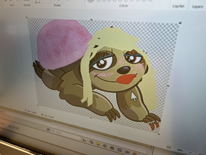 A close-up of a computer monitor showing a digital drawing software workspace with a cartoon character featuring blonde hair, red lips, and a pink beret.