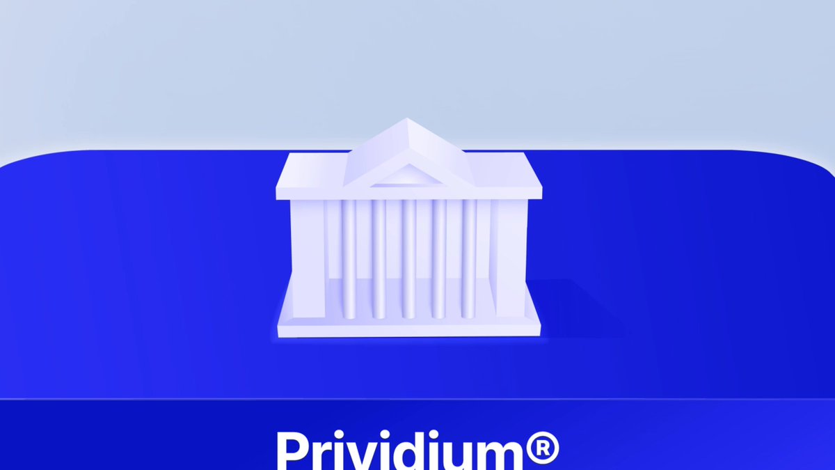 The image features a white building with columns and a dome, which appears to be a miniature replica of a real-life structure. The building is placed on top of a blue surface, creating an interesting contrast between the two colors. The text "Prividium" is written in black at the bottom of the image, indicating that it might be related to a business or organization named Prividium.