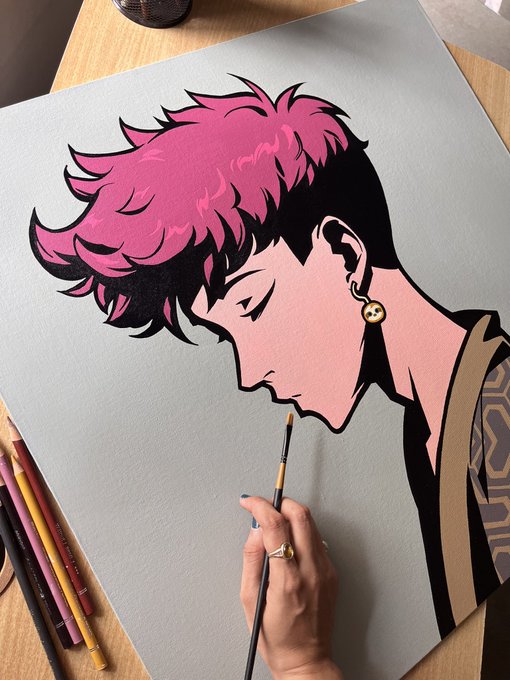A colorful illustration of a pink-haired anime-style character with closed eyes and a peace-sign earring is being painted on a large canvas. The artwork, tagged @Azuki, depicts the NFT collection's signature character design in mid-creation, with an artist's hand and paintbrush visible at the bottom.